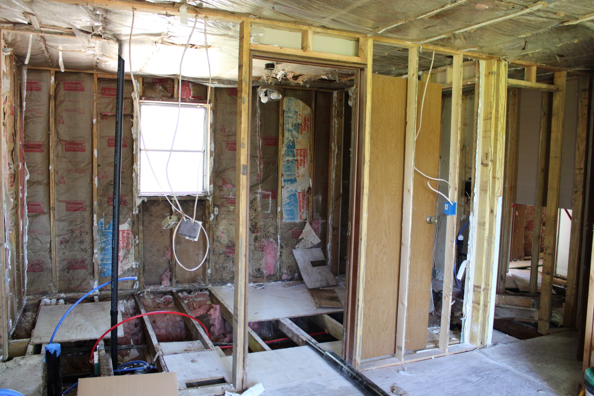 Open residential interior during framing and utility rough-in work